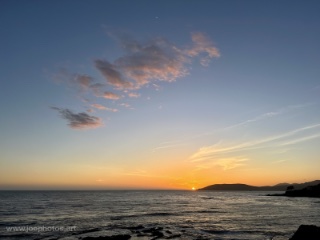 beach sunset with waves and sun
