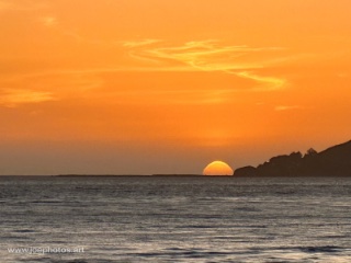 beach sunset with waves and sun