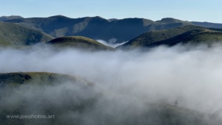 inland marine layer over green hills in Los Osos, California